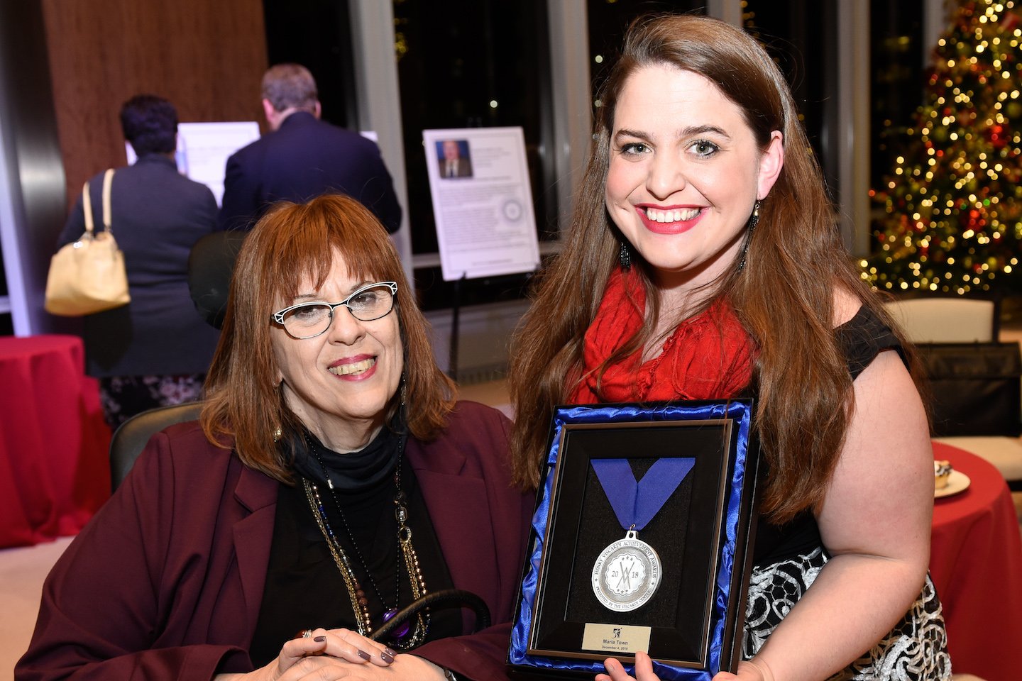 two women holding henry viscardi achievement award